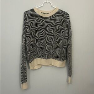 Elegant Black and Cream Striped Sweater